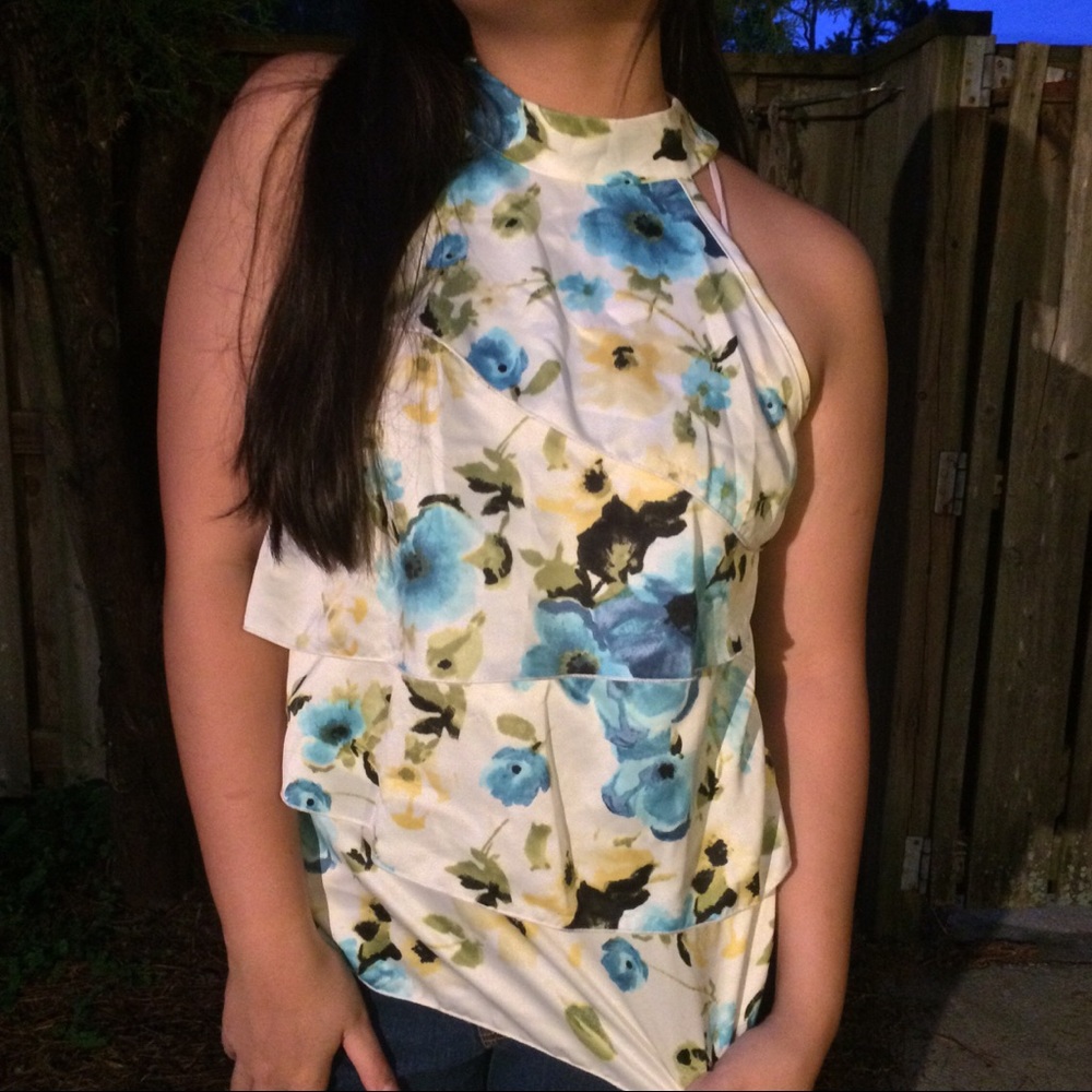Blue and white floral sleeveless tie up blouse